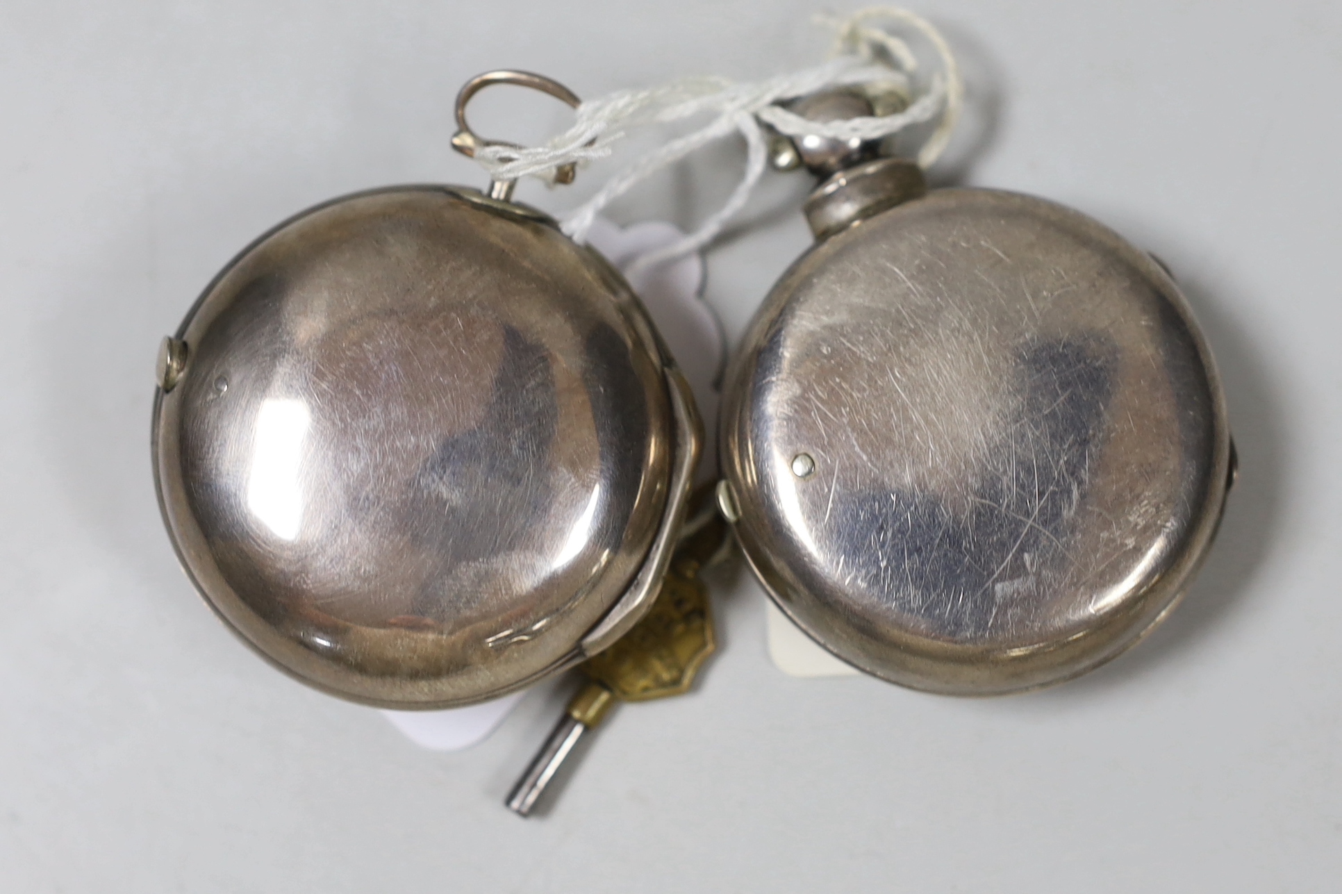 A George III silver pair cased keywind pocket watch, by Butt of London and a similar later watch by Chuter of Farnham.